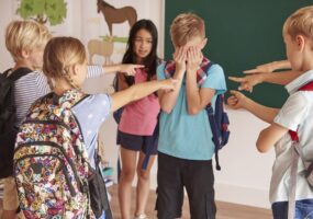 Kids laughing at their classmate