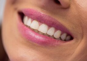 Close-up of female patient receiving a dental treatment at clinic